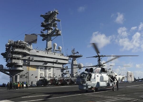 A Russian Navy KA-27 Helix helicopter lands aboard USS Nimitz