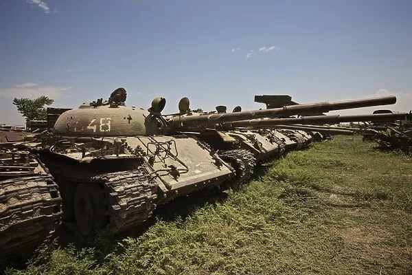 Russian T-62 main battle tanks rest in an armor junkyard