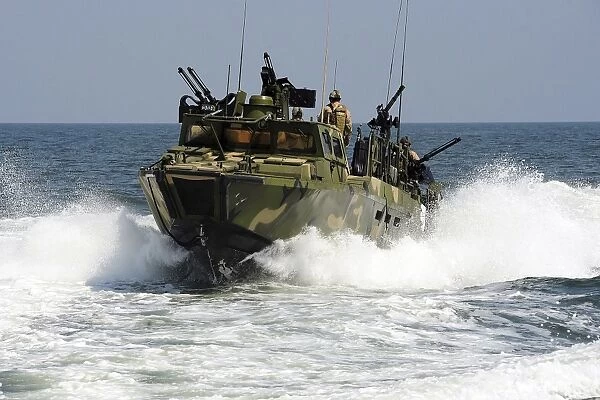 Sailors navigate the waters in a riverine command boat