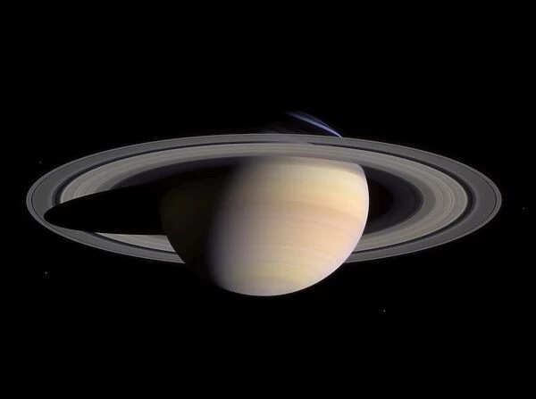 Saturns peaceful beauty invites Cassini for a closer look in this natural color view
