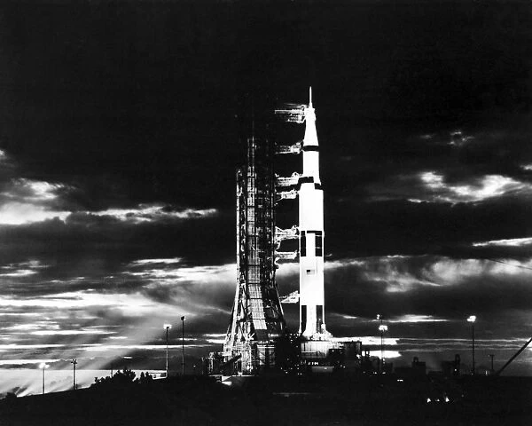 Searchlights illuminate this nighttime view of Apollo 17 spacecraft on its launchpad