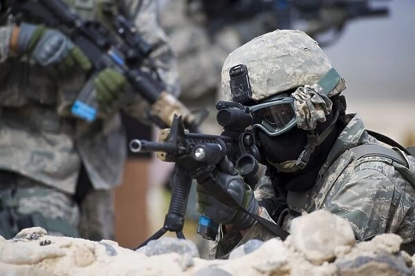 A security forces Airman provides cover for his squad