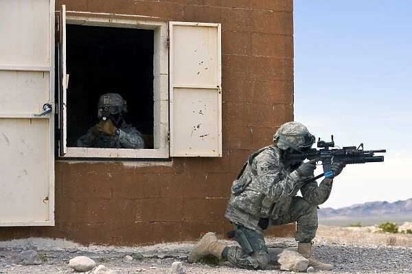 Security forces Airmen guard a building during training