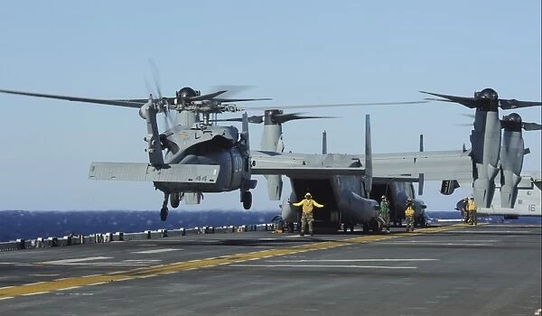 An SH-60 Sea Hawk lands on the flight deck aboard USS Bataan