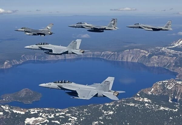 A five ship aircraft formation flies over Crater Lake, Oregon