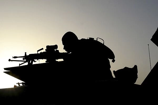 Silhouette of a Squad Automatic Weapon gunner