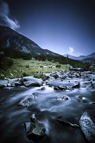 Small river flowing through the mountains of Pirin National Park, Bulgaria