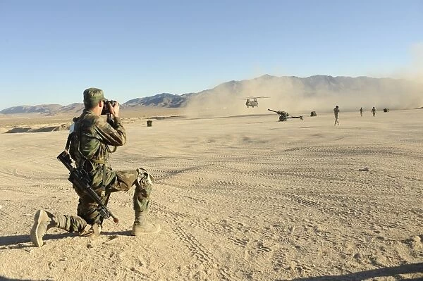 A soldier documents a CH-47 Chinook during a full-spectrum operations exercise