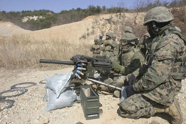 A soldier fires a MK19 40mm heavy machine gun
