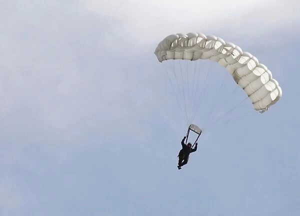 A soldier floats to the ground during High Altitude Low Opening training