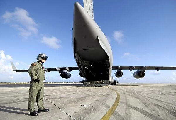 A soldier waits for his C-17 Globemaster III to launch