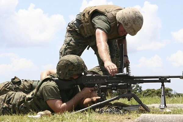Soldiers fire a M240G medium machine gun