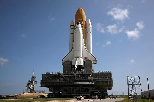 Space Shuttle Discovery makes its way to the launch pad at Kennedy Space Center