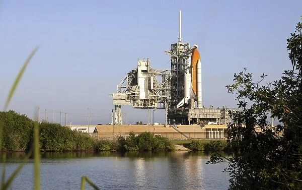 Space Shuttle Discovery sits ready on the launch pad at Kennedy Space Center