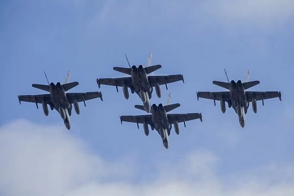 Four Spanish Air Force F-18M Hornets fly in formation above Spain