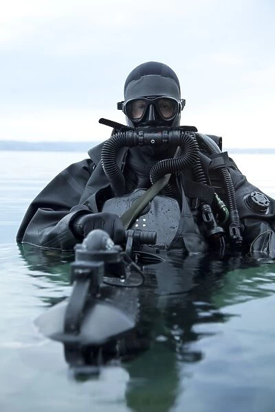 Special operations forces combat diver with underwater propulsion vehicle