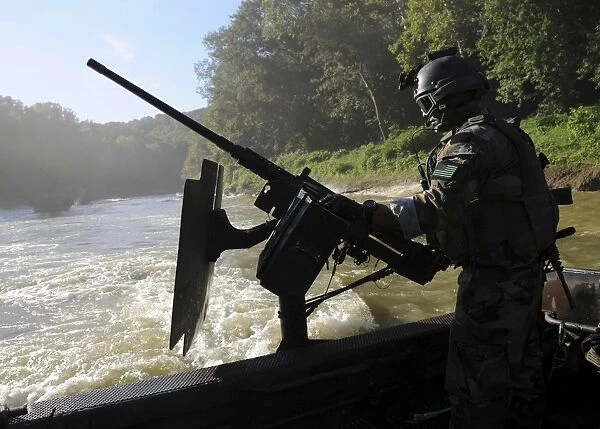 A Special Warfare Combatant-craft Crewman manning an M240N