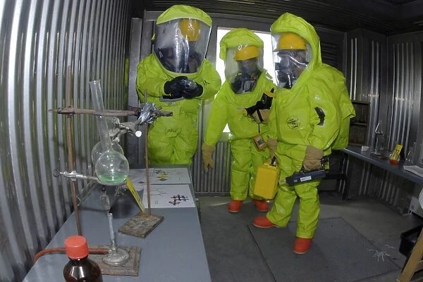 Specialists survey a simulated area during a HAZMAT exercise