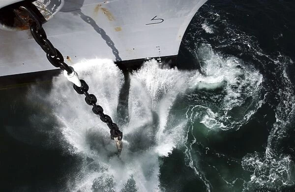 The starboard anchor of USS Ronald Reagan is released into the ocean