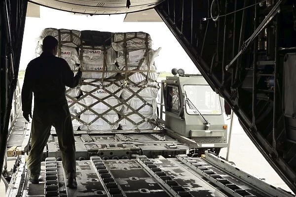 Supplies are loaded into a C-130 Hercules