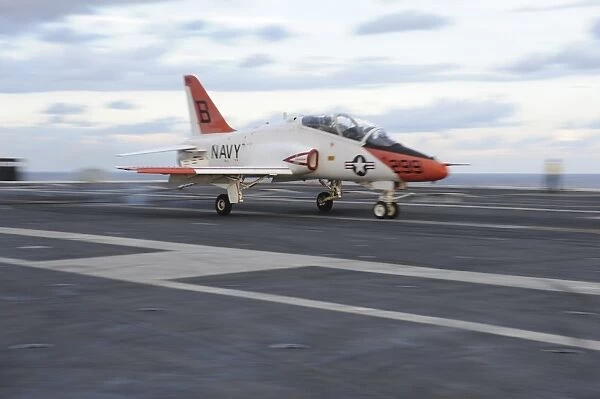 A T-45C Goshawk is launched from the flight deck of USS Theodore Roosevelt