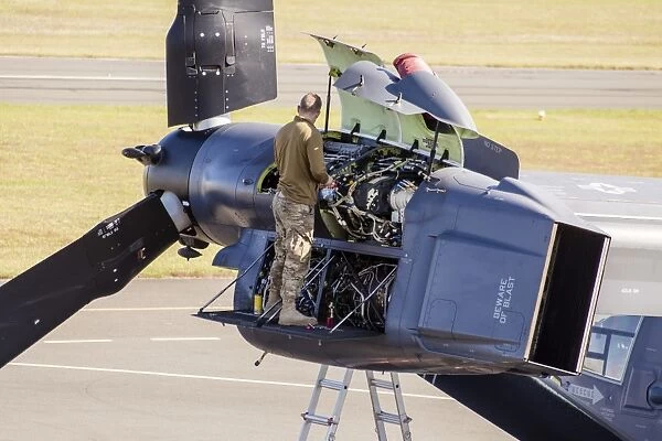 Technician working on a faulty engine of a CV-22 Osprey
