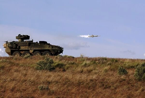 A TOW missile is launched from an armored vehicle
