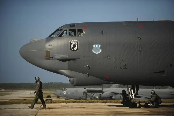 A U. S. Air Force aircrew prepares a B-52 Stratofortress aircraft for a mission