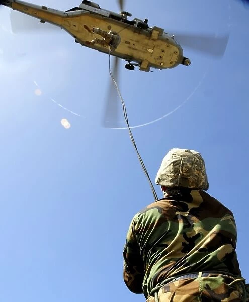 U. S. Air Force airmen conducting rappelling and fast-roping techniques at Andersen Air Force Base