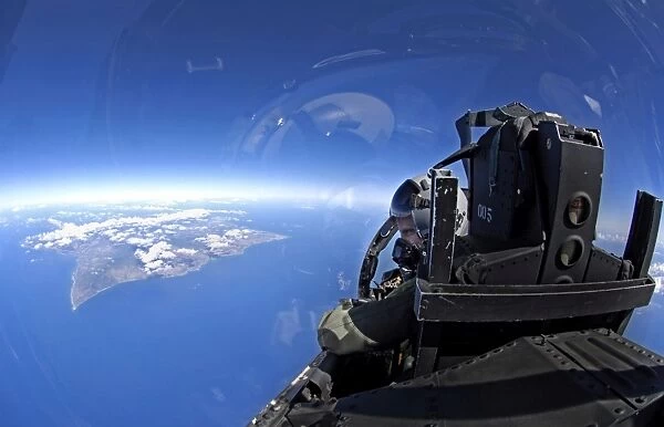 U. S. Air Force captain looks out over the sky in a F-15 Eagle