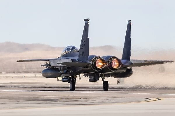 A U. S. Air Force F-15E Strike Eagle takes off in full afterburner