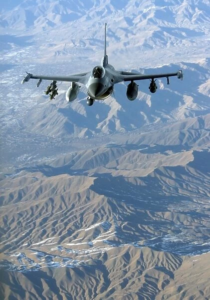 A U. S. Air Force F-16C Fighting Falcon in flight over Afghanistan