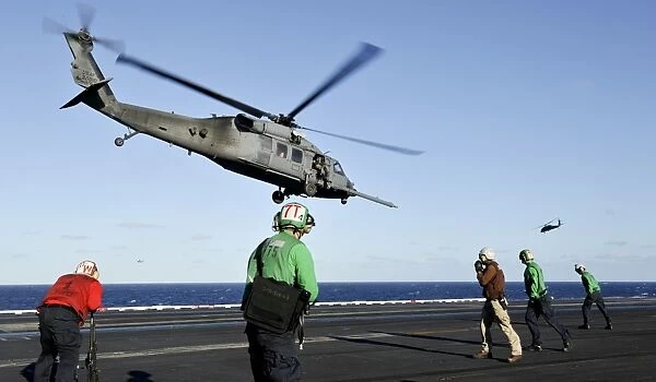 A U. S. Air Force HH-60G Pave Hawk helicopter lifts off from USS Nimitz