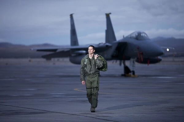 A U. S. Air Force pilot walking away from a F-15C Eagle