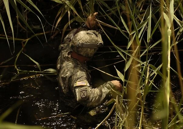 A U. S. Army Soldier searches for missing Soldiers