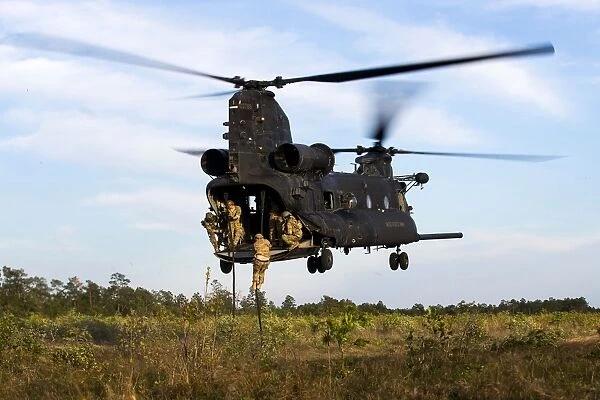 U. S. Army Soldiers fast-rope out of a CH-47 Chinook