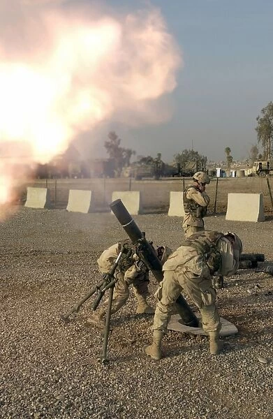 U. S. Army Soldiers fire a 120mm M120 Battalion Mortar