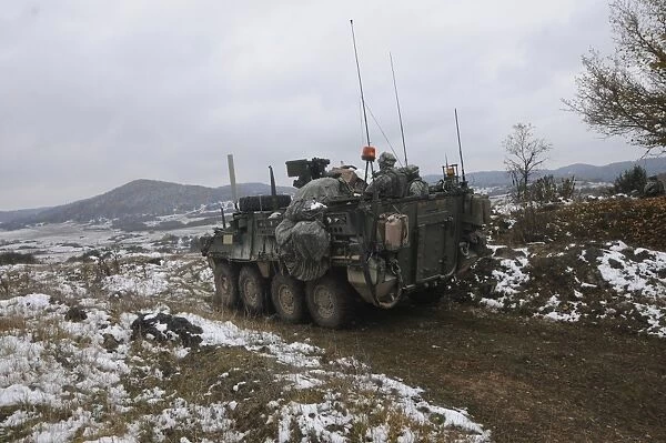 U. S. Army soldiers pull security in a Stryker armored vehicle
