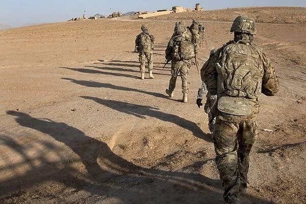 U. S. Army soldiers walk toward a checkpoint in Afghanistan