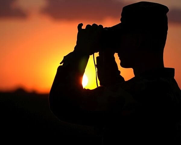 U. S. Army Specialist scans the horizon
