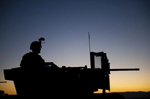 A U. S. Marine keeps watch during a security halt