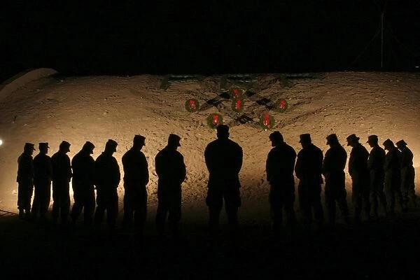 U. S. Marines bowing their heads in silence in honor of fallen comrades