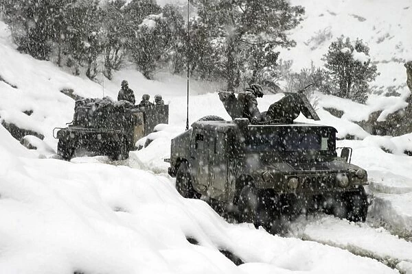 U. S. Marines conducting a mounted patrol in the snowy weather of the Khowst-Gardez