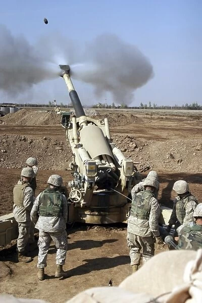 U. S. Marines engage enemy targets with an M-198 155mm Howitzer