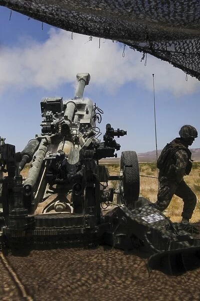 U. S. Marines fire an M777 howitzer