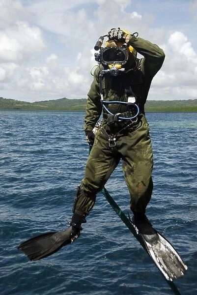 U. S. Navy Diver jumps off a dive station