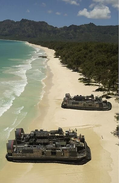 U. S. Navy Landing Craft land on the beach to offload equipment in Oahu, Hawaii