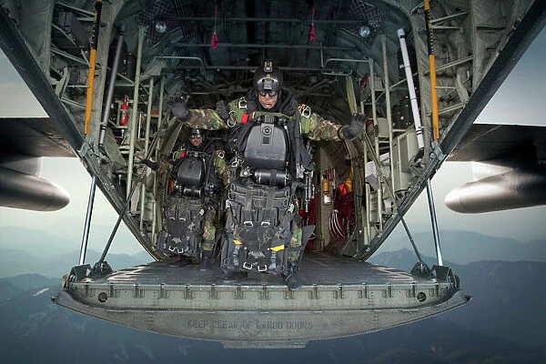 U. S. Navy SEALs combat diver prepares for HALO jump operations from a C-130 Hercules