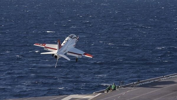 A U. S. Navy T-45C Goshawk performs a touch-and-go landing
