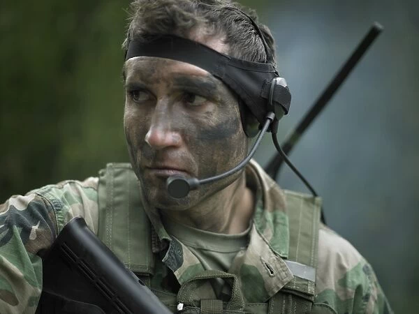 U. S. Special Forces soldier equipped with a communications headset during combat
